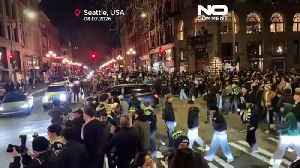 Fans with fireworks celebrate Super Bowl in Seattle streets