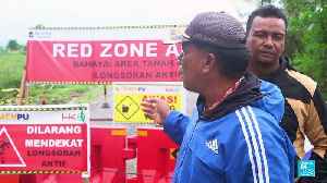 Massive sinkhole swallows farmland in Indonesia