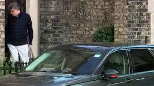 Mandelson seen leaving London home