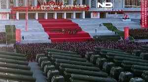 North Korean leader Kim Jong Un drives rocket launcher vehicle
