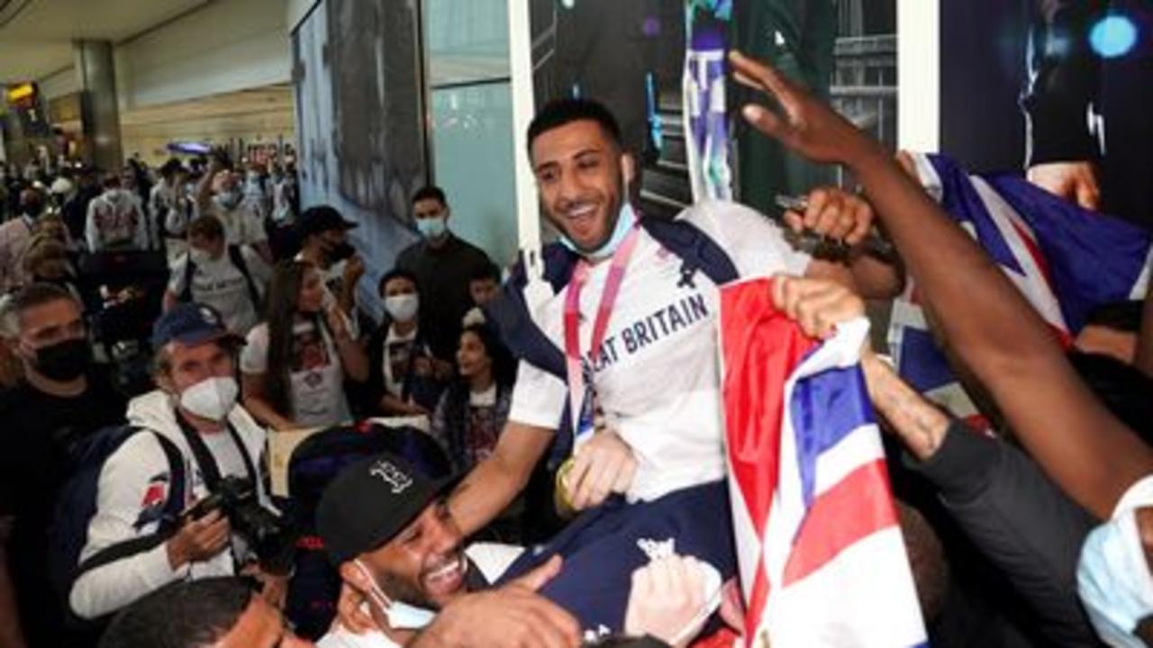 Team GB boxer mobbed by his friends