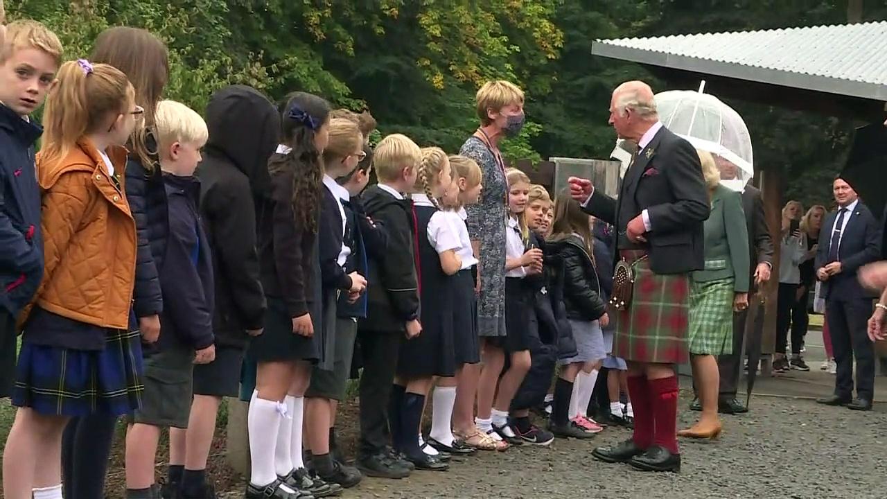 Charles and Camilla enjoy a wee dram at Burns' Cottage