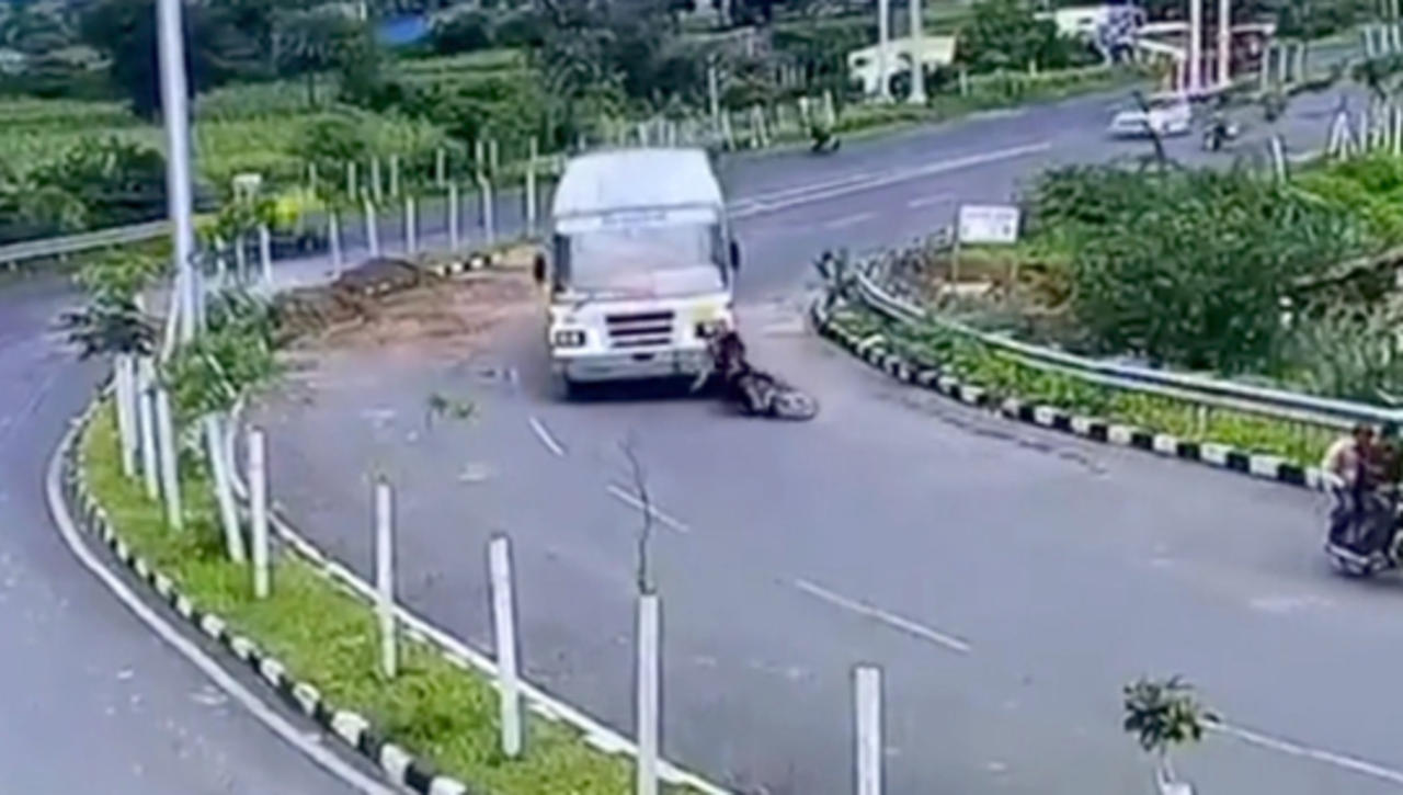 Motorcyclist Hit by a Bus, Miraculously Emerges Unharmed From Beneath Its Wheels