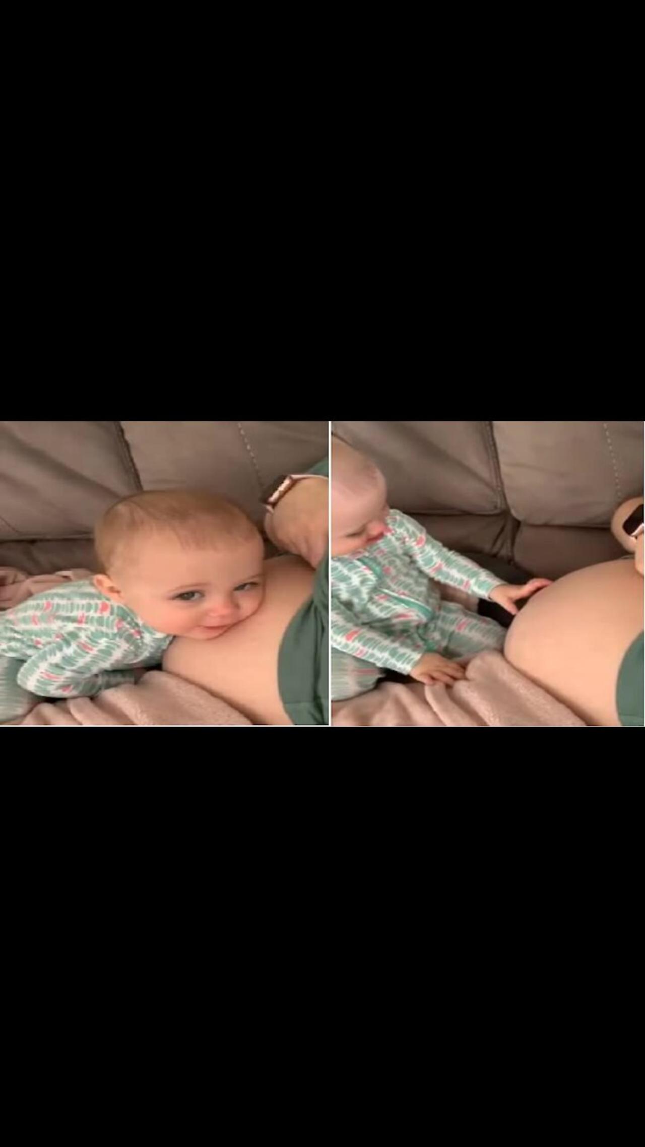 Sweet toddler preciously kisses mommy’s pregnant belly