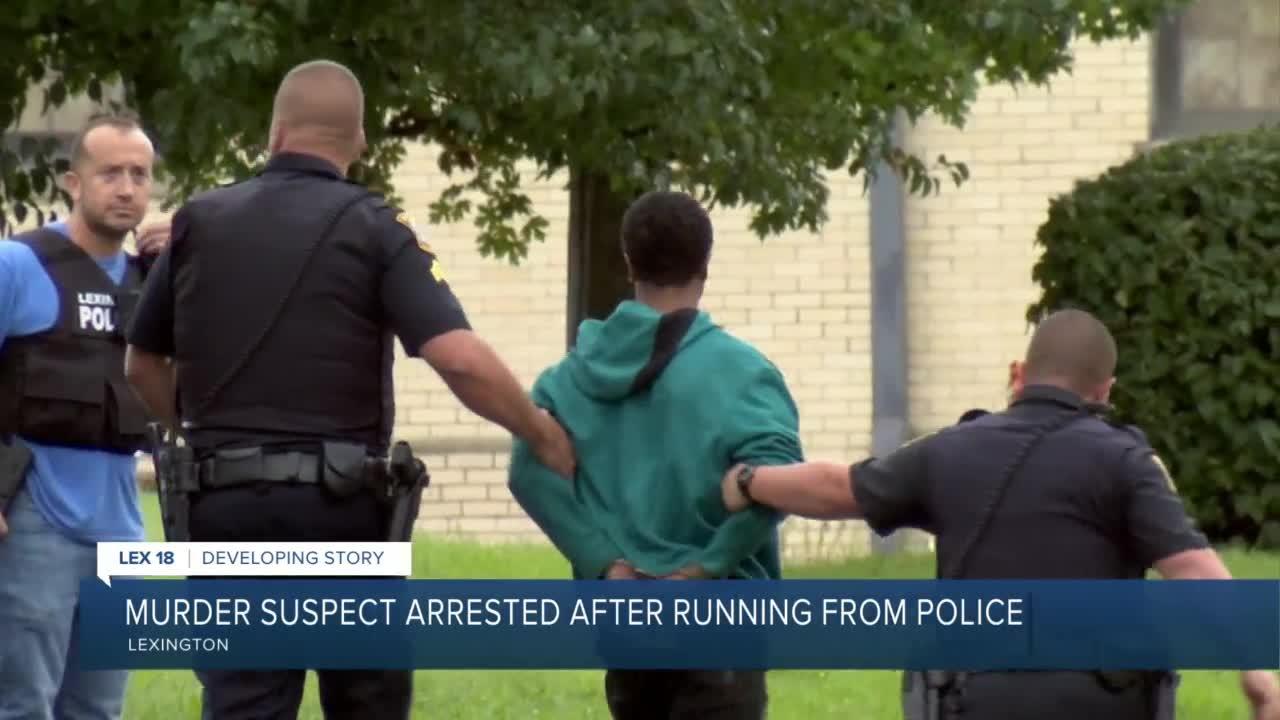 Murder suspect arrested after running from police