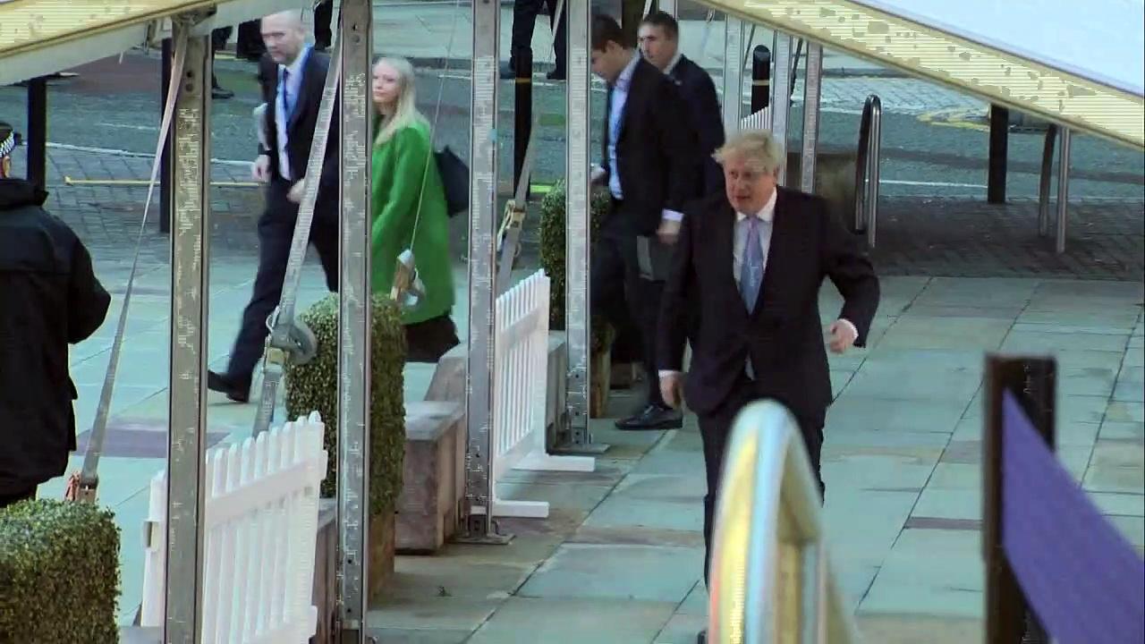 Boris Johnson makes his entrance at Tory party conference