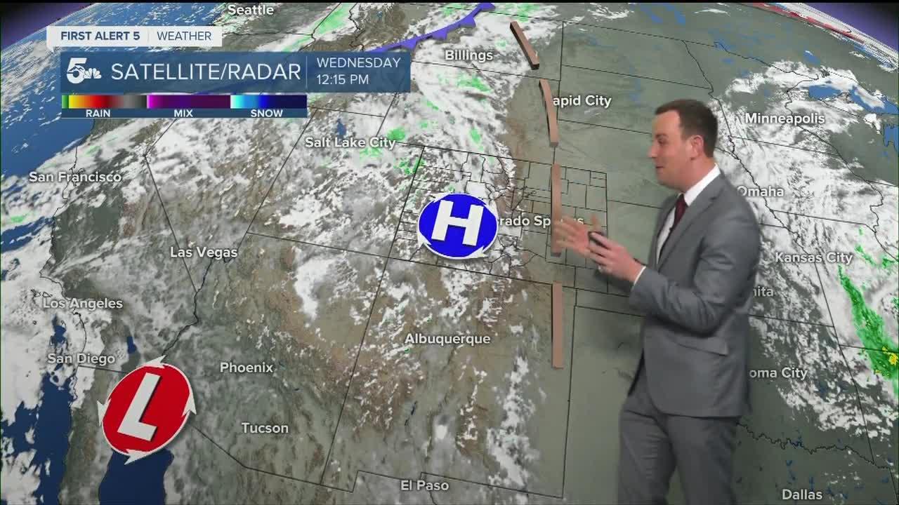 Warm and breezy today with rain west into the high country