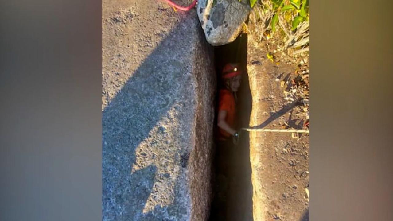 A dog fell 40 feet down narrow crevice. Only 1 woman was small enough to save her