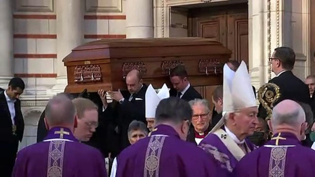 Sir David Amess: family sprinkle coffin with holy water