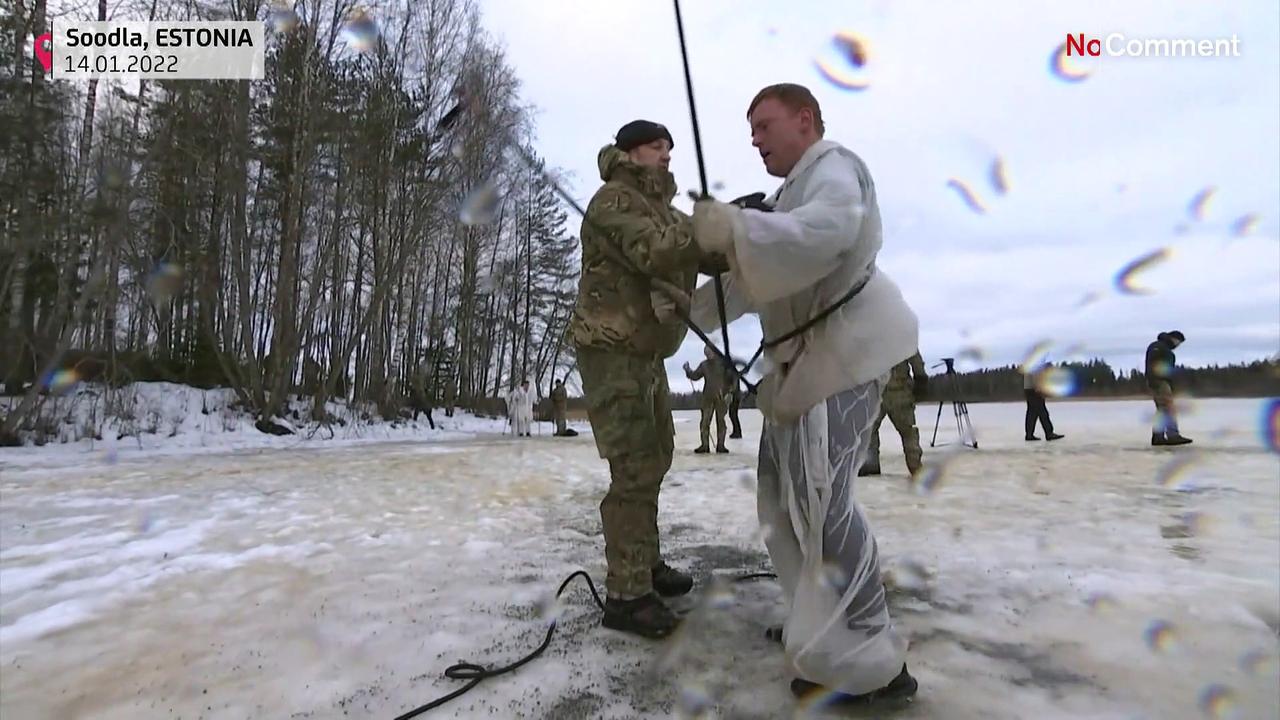 British soldiers jump into the icy water in Estonia.