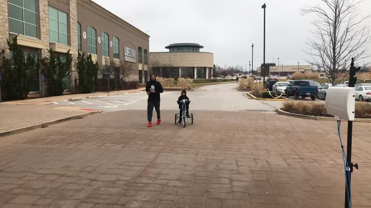 specialmoms_corner - adorable little boy finishes his first 5K with handicap bike.MOV
