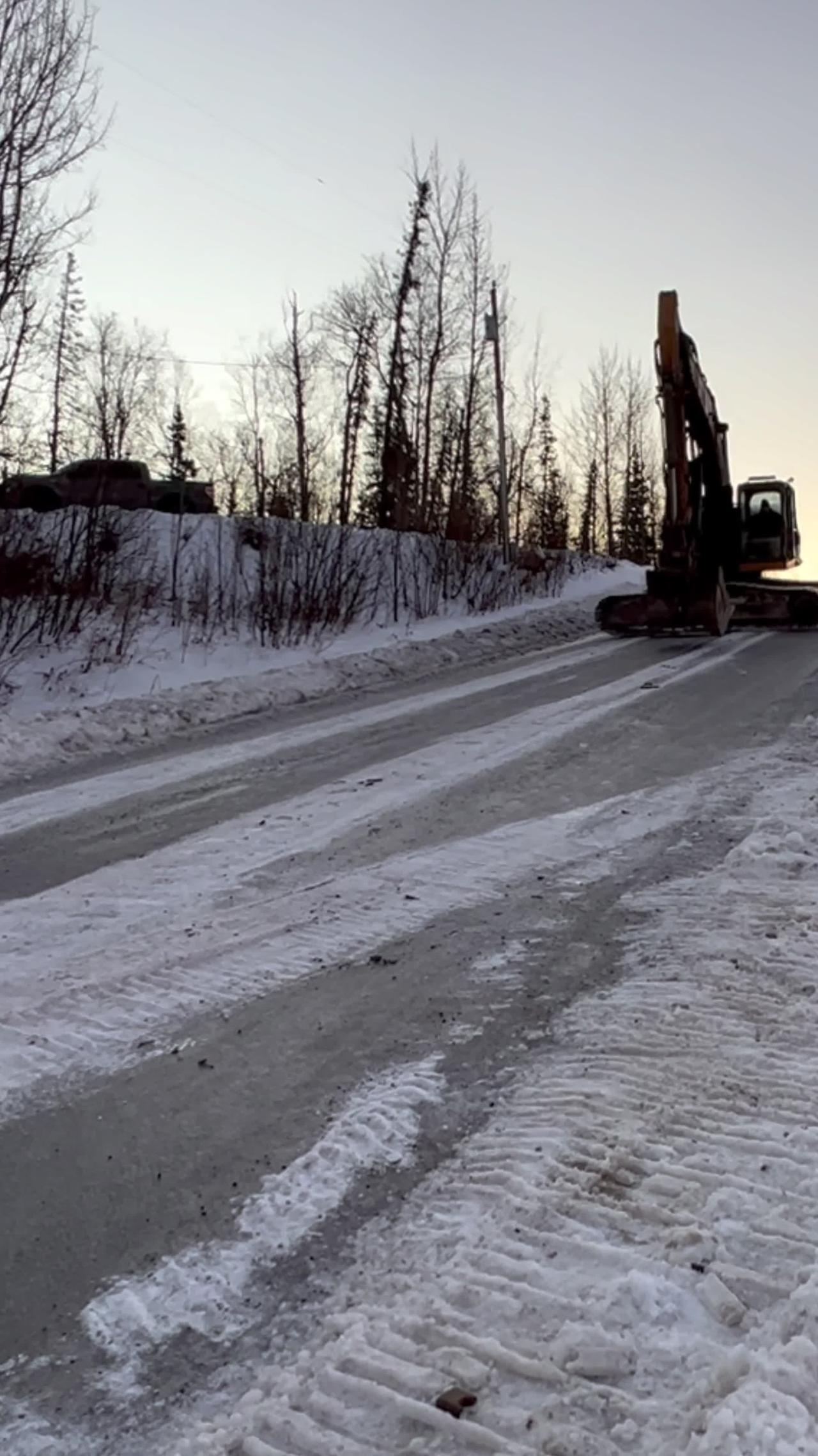 Sliding a Backhoe Down an Icy Road