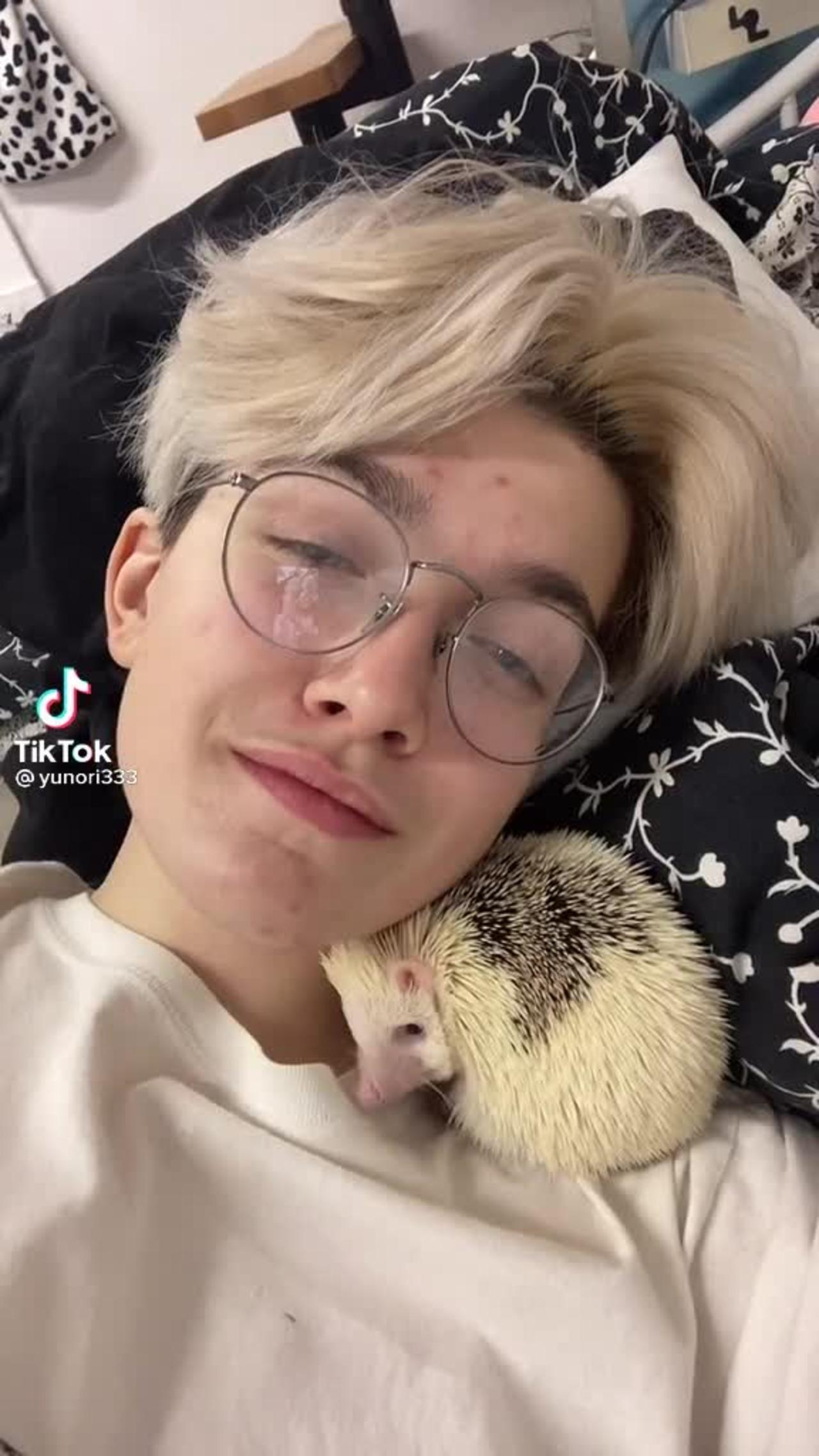 chilling with my hedgehog pet