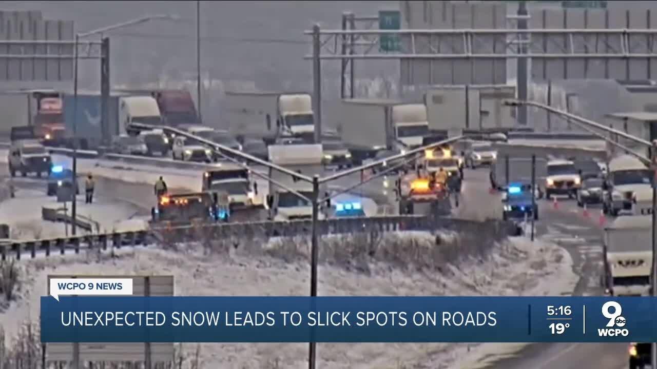 Unexpected snow leads to slick spots, traffic problems