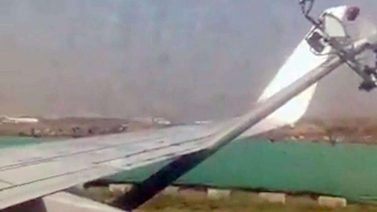 Boeing 737 crashes into lamppost at airport in India