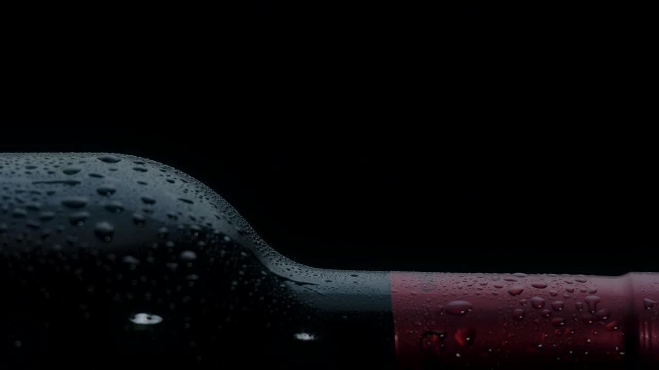 Wine bottle lying on a black background