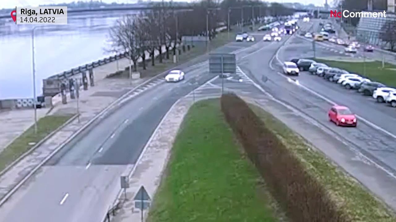 Unoccupied car rolls across road and into river in Riga