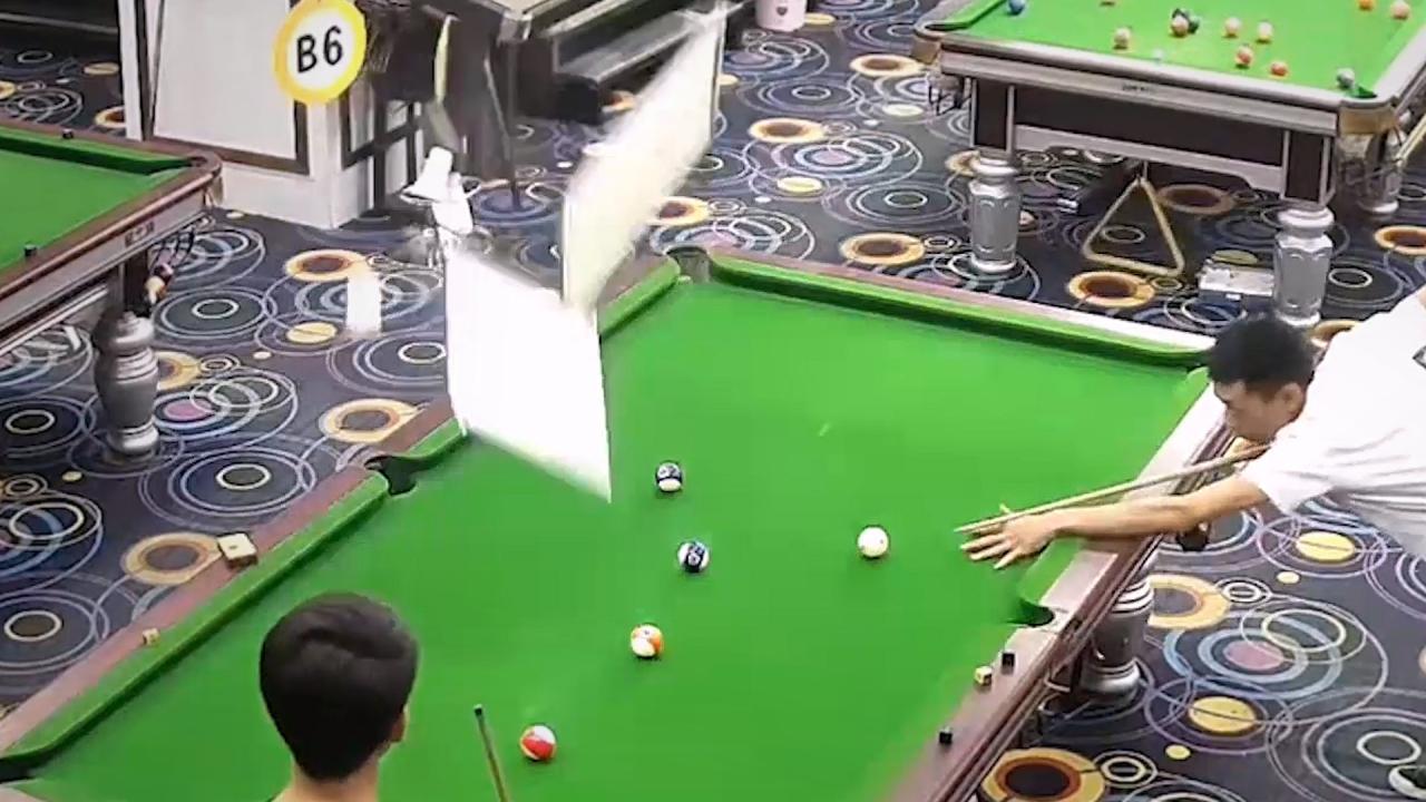 Pool player obliterates overhead lights in hilarious fail moment