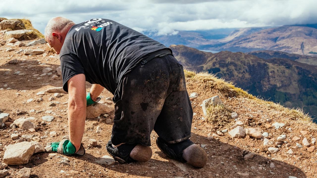 Inspiring double amputee crawls up Britain's highest mountain