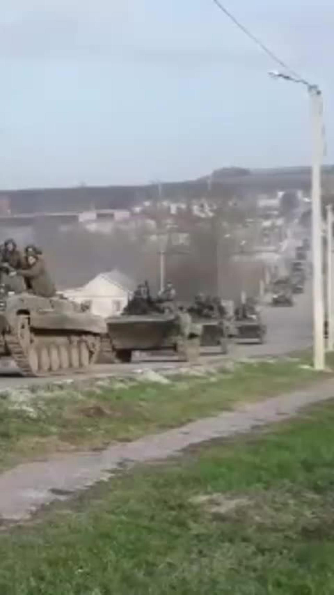 Russian troops advance through liberated territory in Ukraine