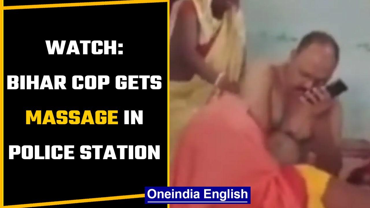Bihar: Woman, whose son was in jail, massages cop inside police station | Watch | Oneindia News