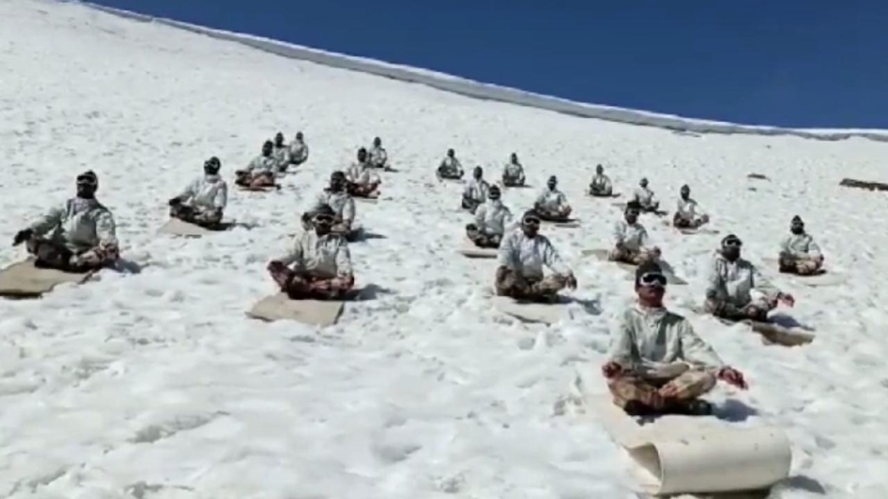 Border police perform yoga on snow-capped mountain in northern India