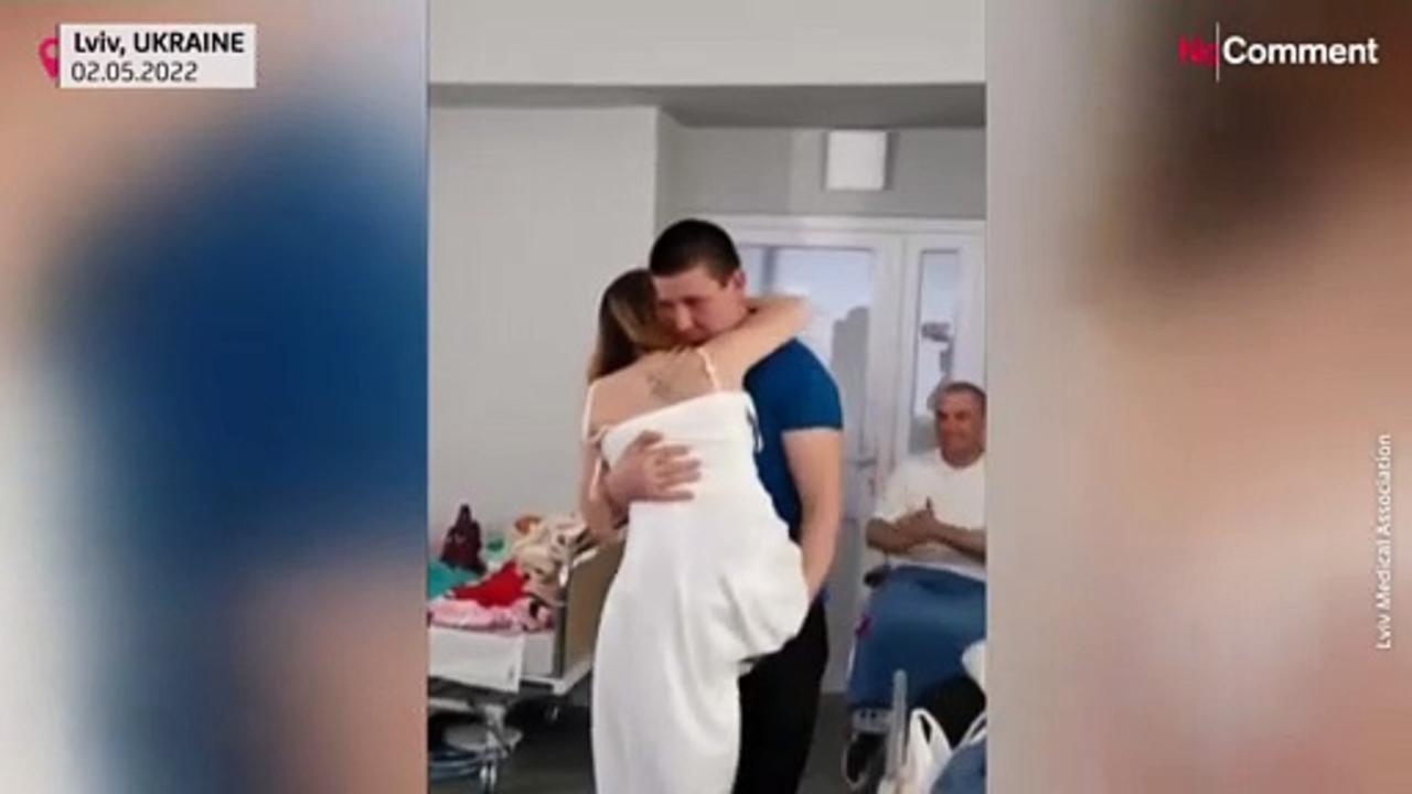 Ukraine nurse who lost legs in landmine explosion dances with new husband in Lviv hospital