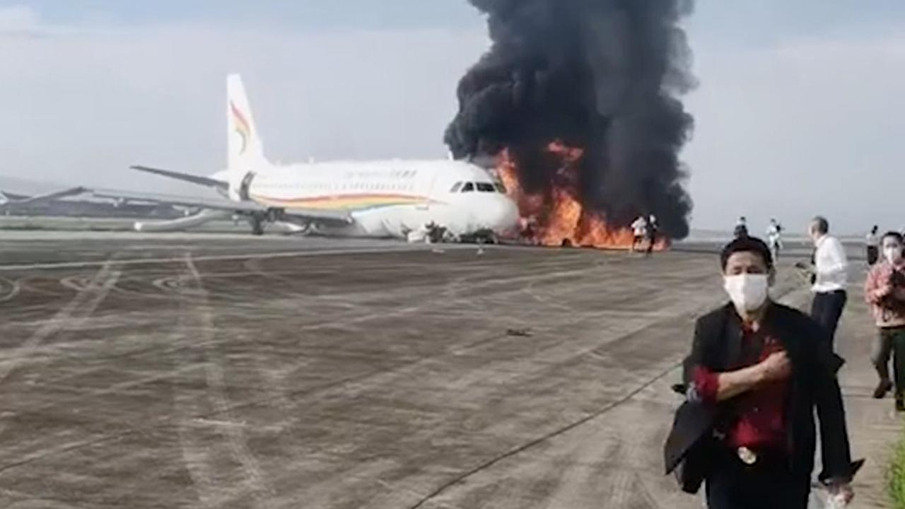 Plane erupts into flames after skidding off runway in China