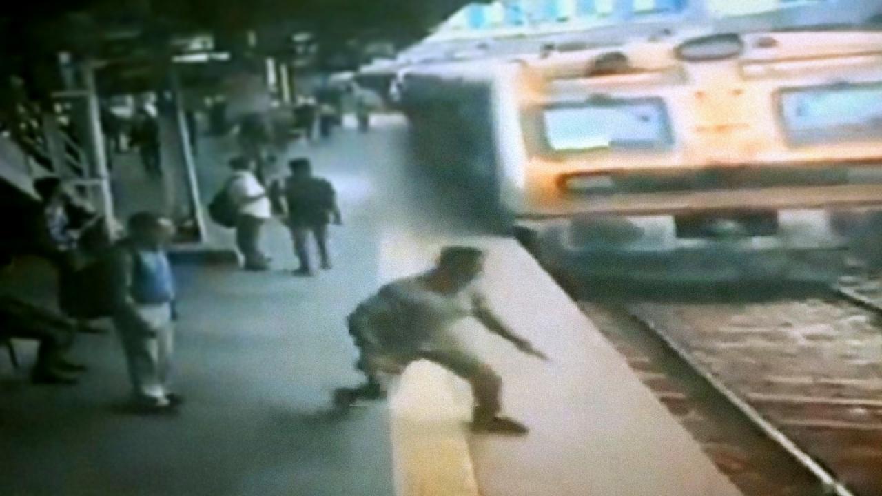 Heroic policeman saves man on railway tracks, with just seconds to spare
