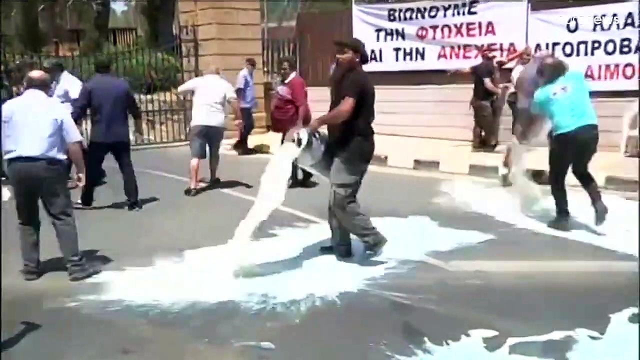 Cyprus farmers spill milk in protest over halloumi cheese protection