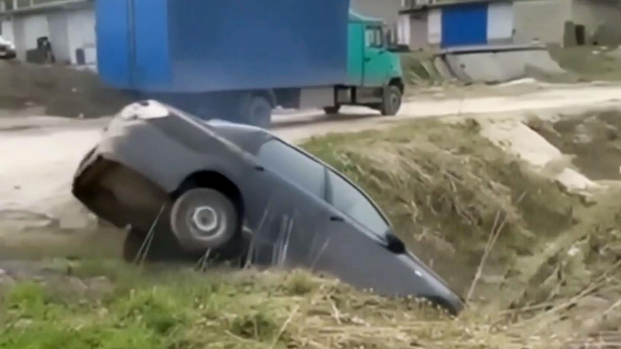 Truck driver's attempt to drag car out of ditch ends in epic fail