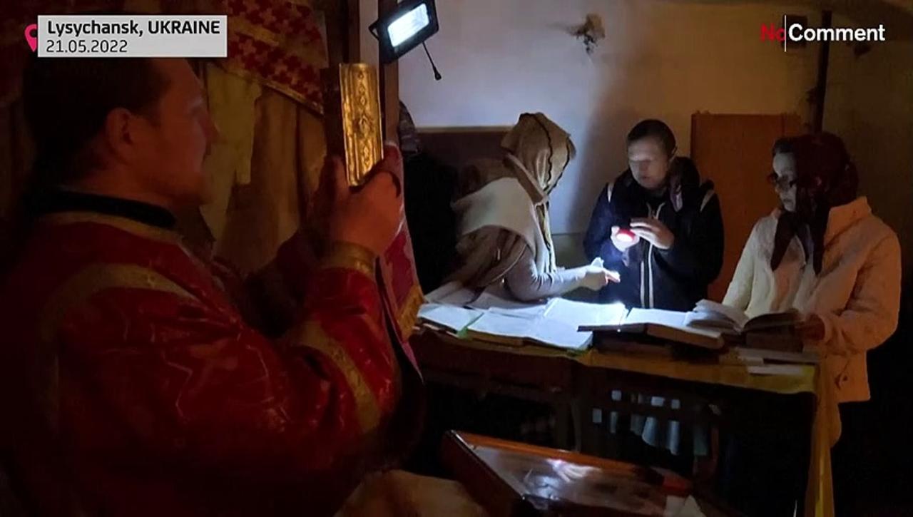 Priest holds mass in basement of Ukraine church amid sounds of Russian shelling