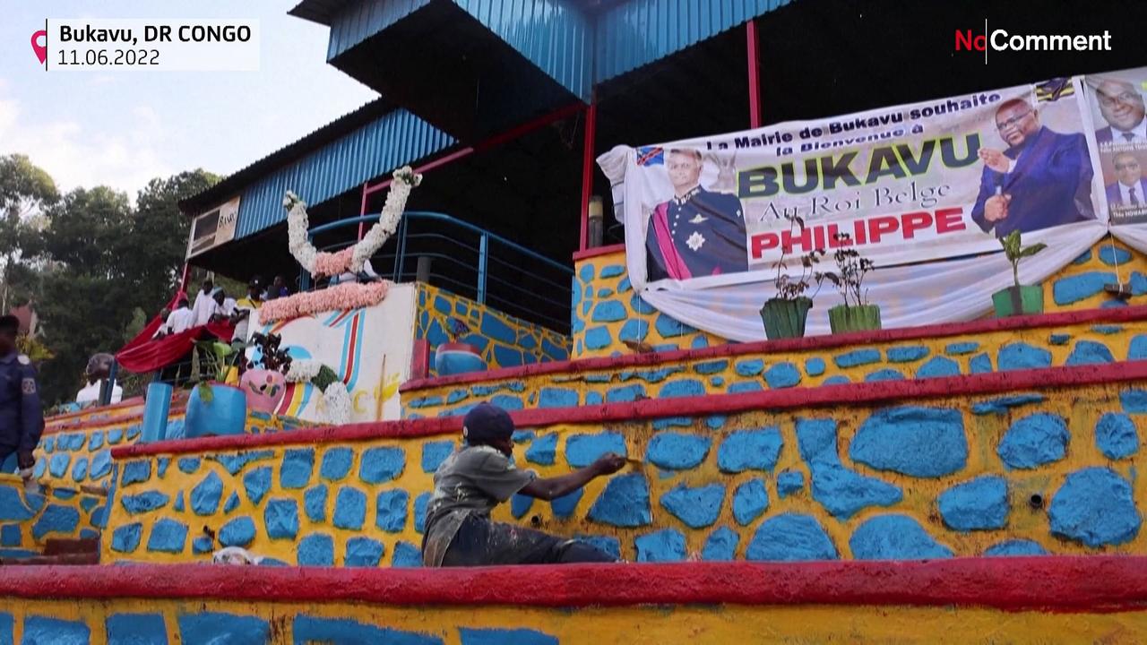 DRC residents repaint buildings for the arrival of the Belgian king