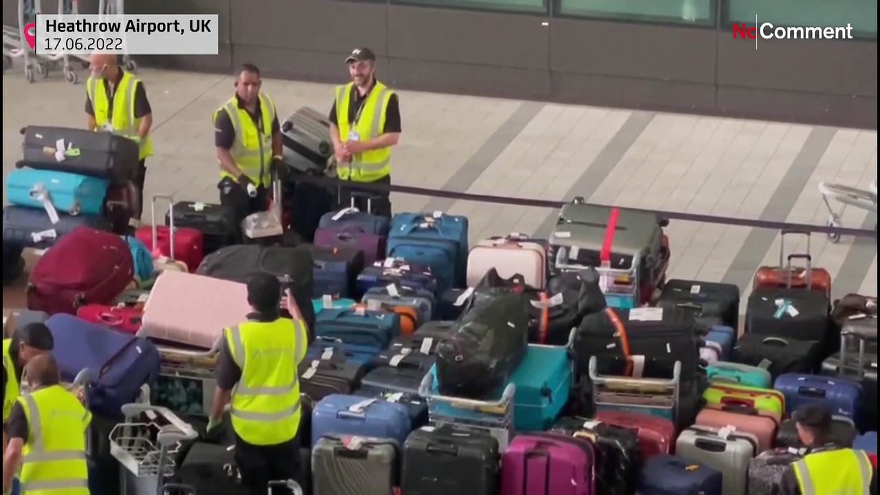 Piles of luggage carpet area of Heathrow Airport