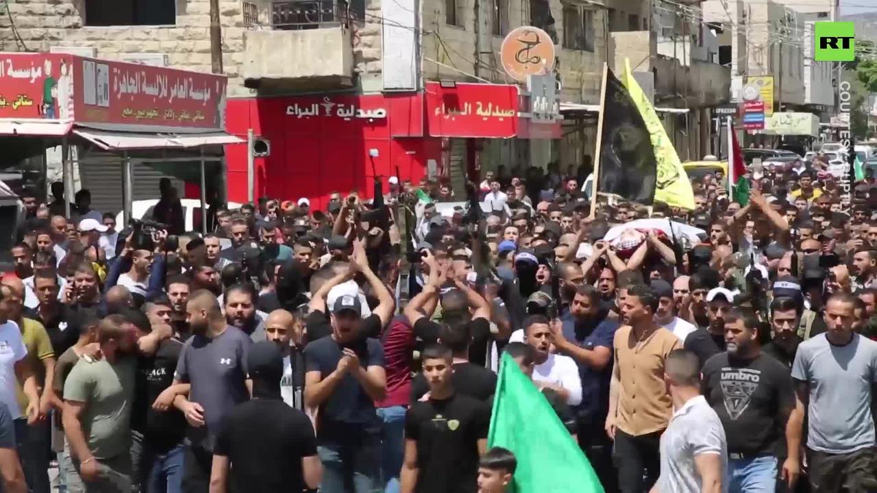 Gunfire rings out at funeral procession for Palestinians killed by IDF