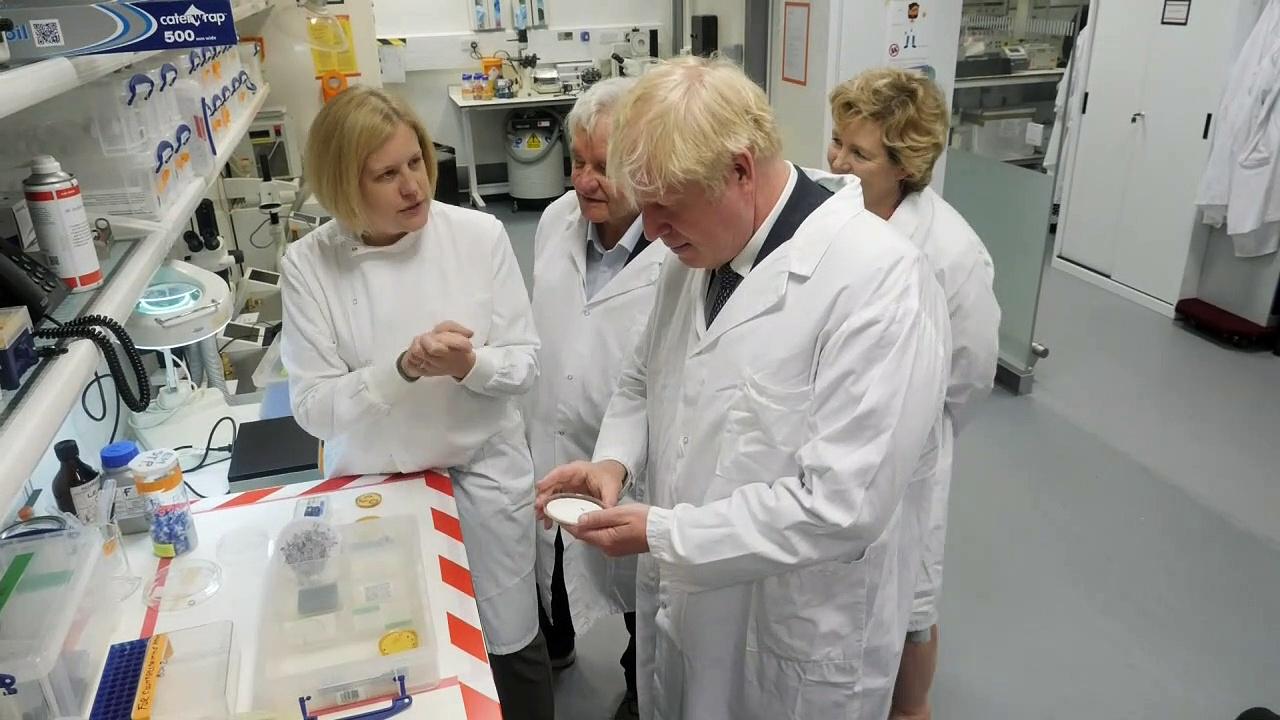PM inspects samples and tests equipment at research lab
