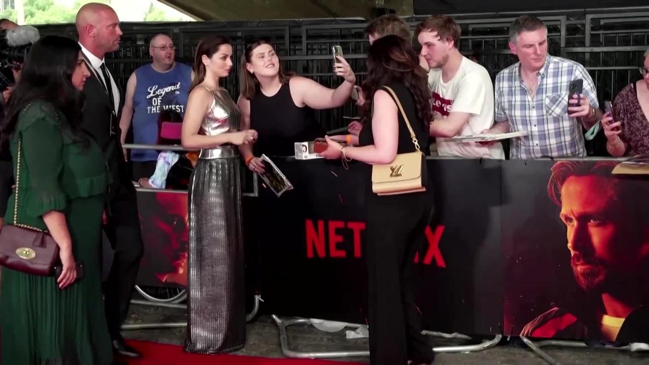 Fans gather for ‘The Gray Man’ premiere amid heat wave