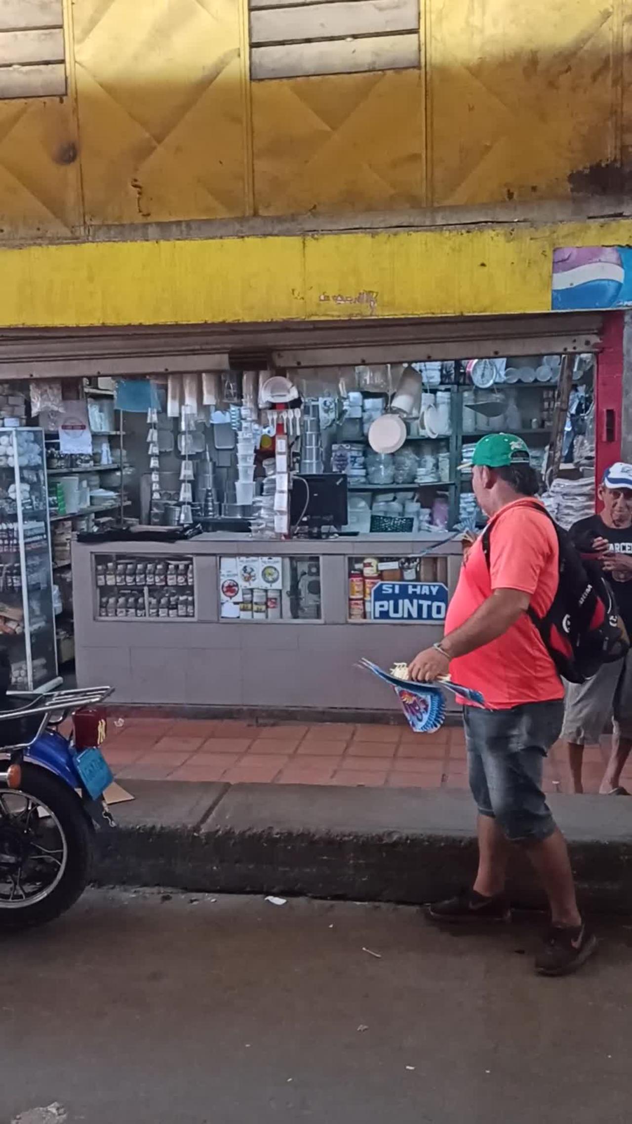 Mans Sells Flying Bird Toys in Venezuelan Market