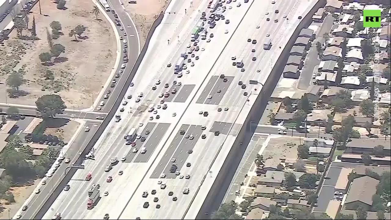 Plane crash lands on California freeway