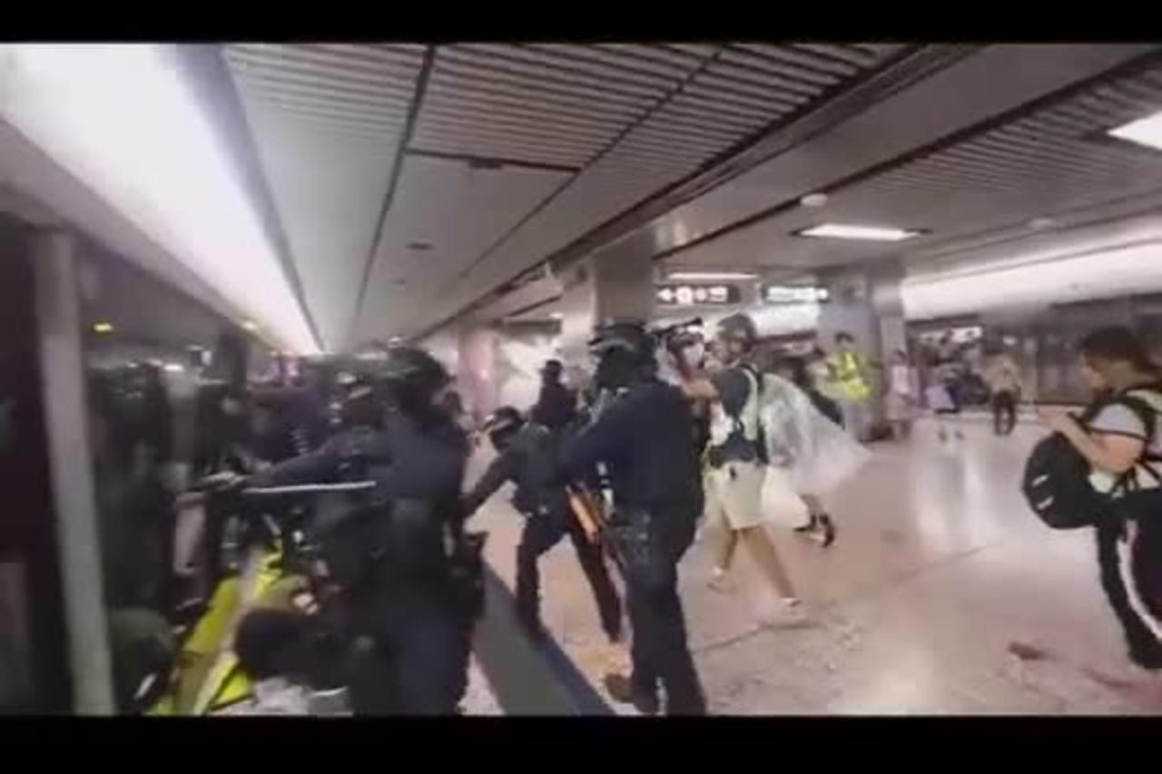 Chinese Government Stormtroopers Besiege Subway Train as They Beat & Spray Peaceful Citizens