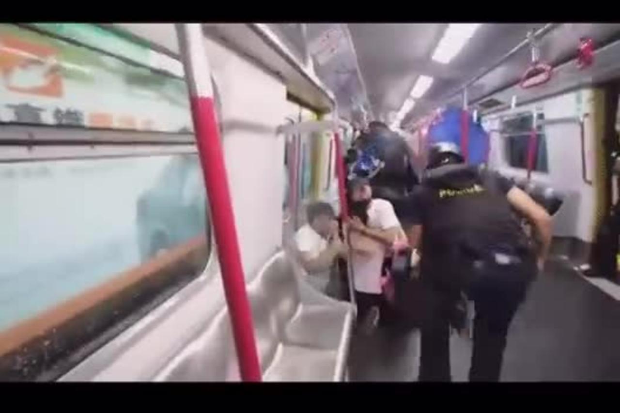 Chinese Stormtroopers Besiege Subway Train as They Beat and Spray Peaceful Citizens