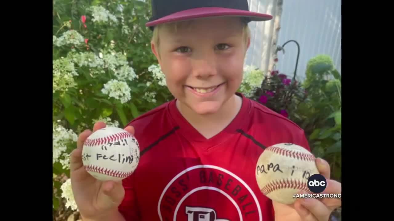 Boy signs first homerun ball for his grandpa