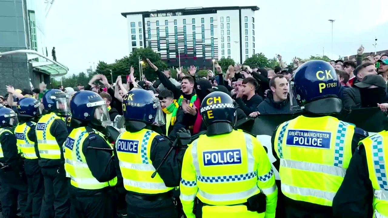 Man United supporters clash with police at protest