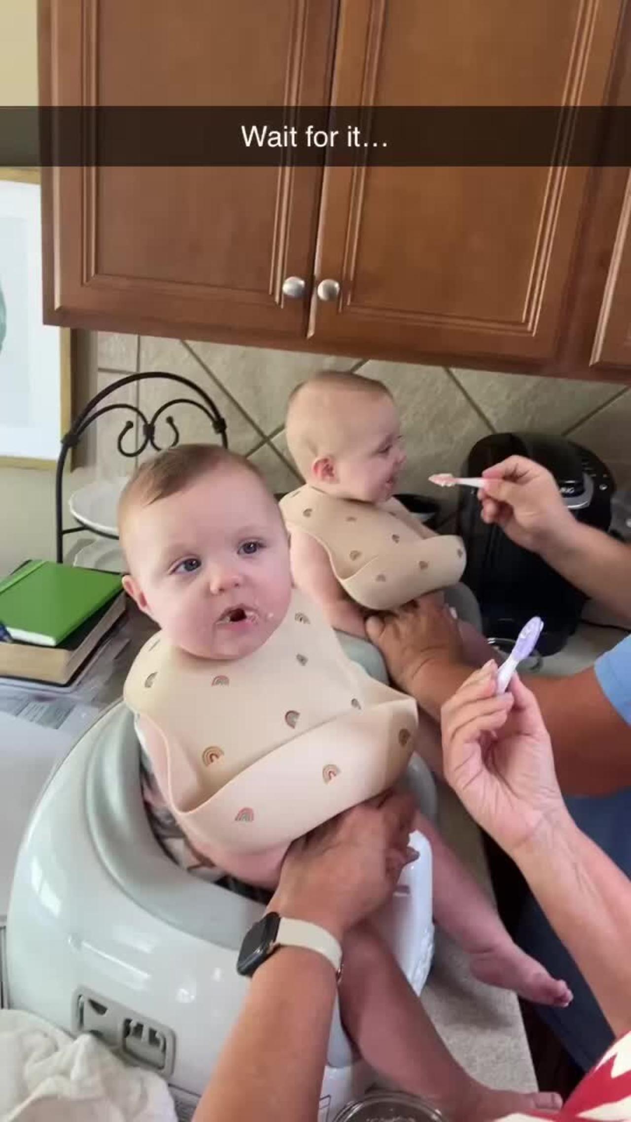 Identical twin girls being funny while their grandparents feed them!.MOV