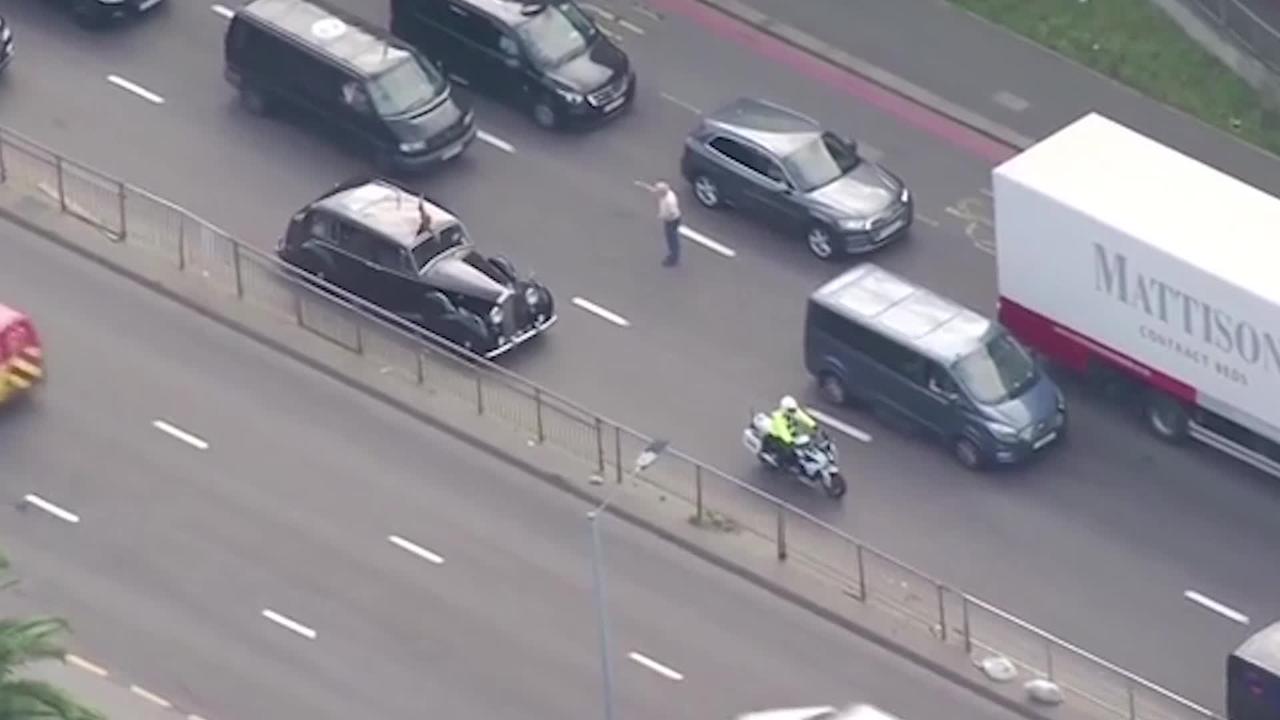 King Charles in security scare as man runs out in front of car - VIDEO