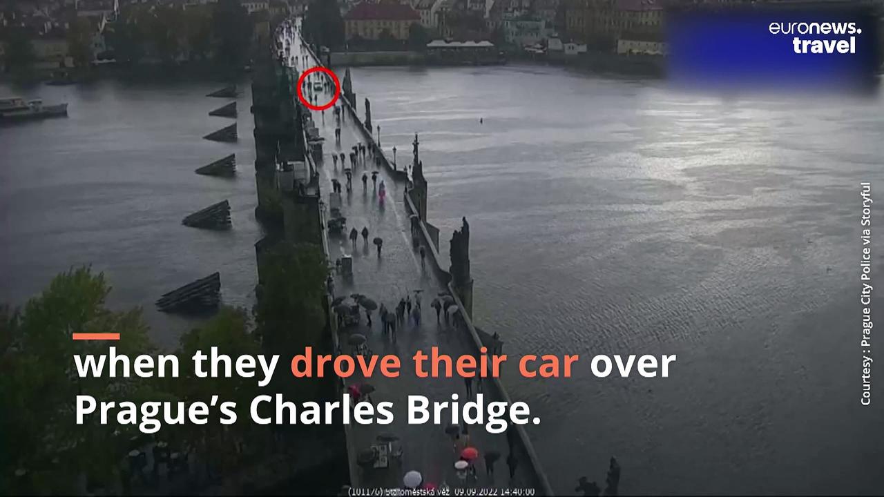 Watch as a tourist illegally drives over Prague's iconic Charles Bridge - then gets fined