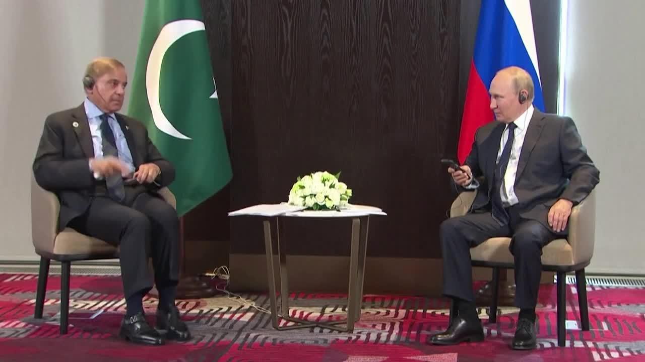 Having trouble with his headphones when he meets Putin at the SCO conference is Pakistan's Sharif.