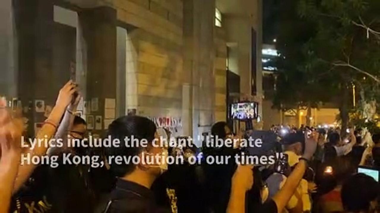 Hong Kongers sing protest song at vigil mourning the Queen