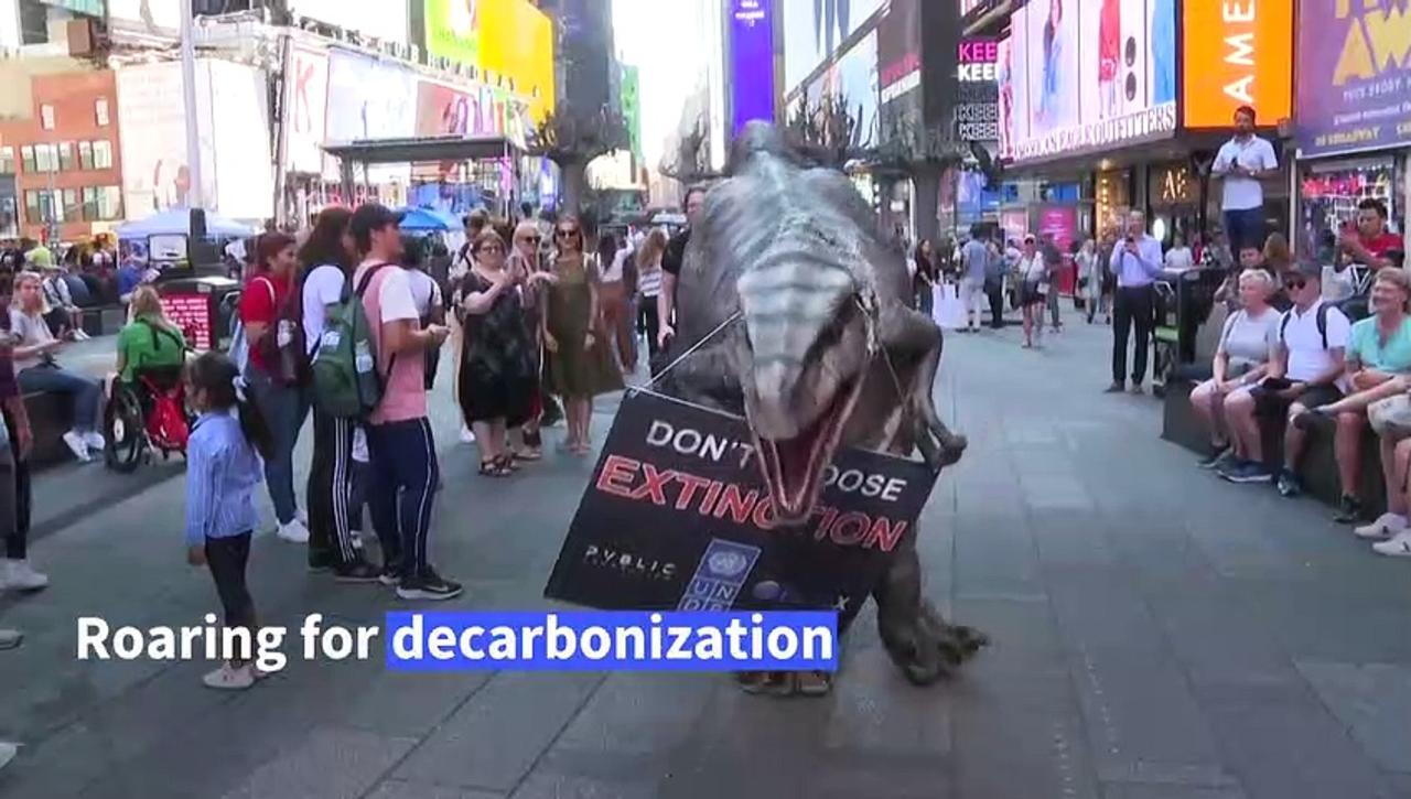 Frankie the Dino roars for decarbonization in Times Square amid UN General Assembly