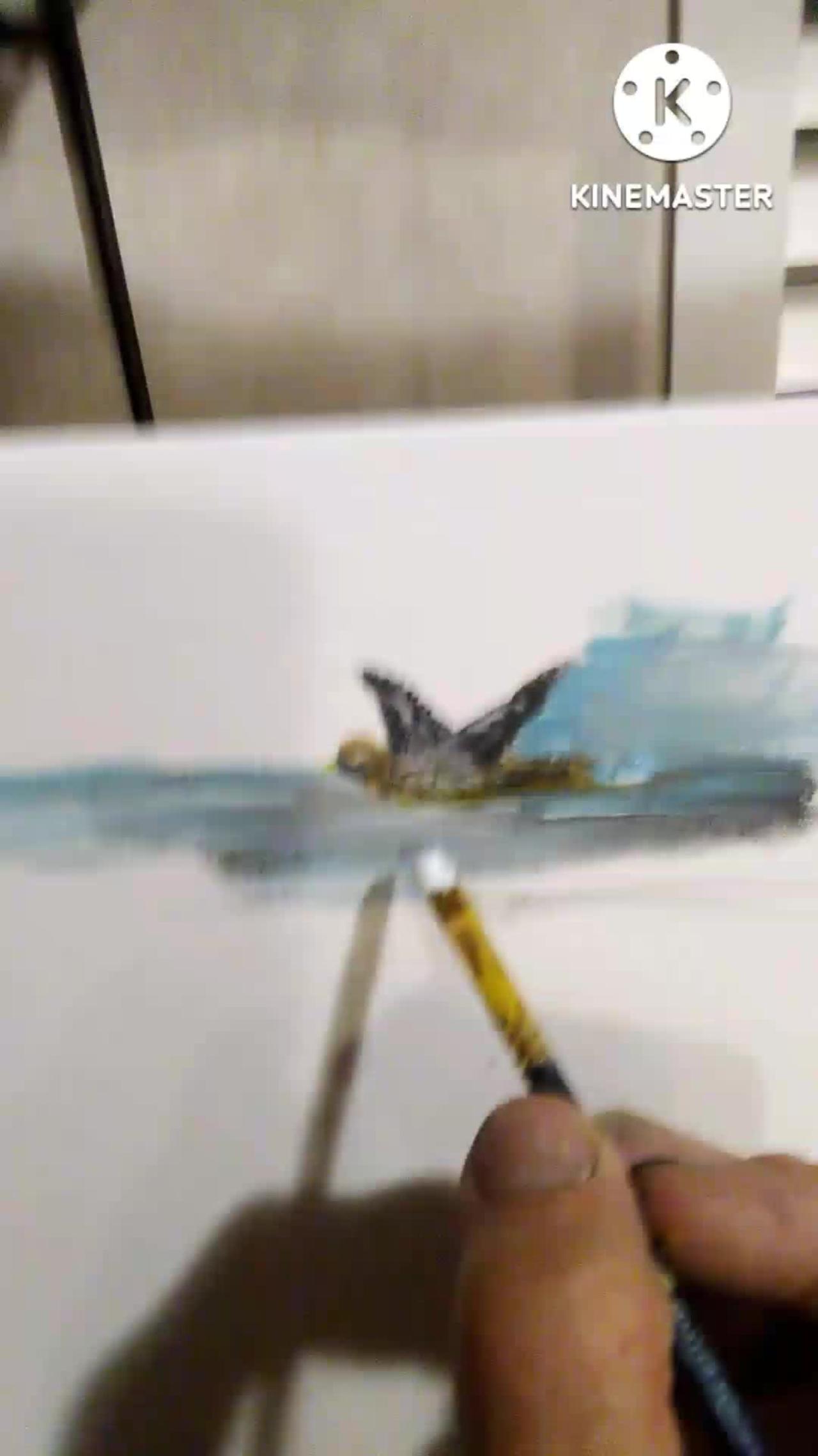 Eddie Nilan Art in studio Painting a bird